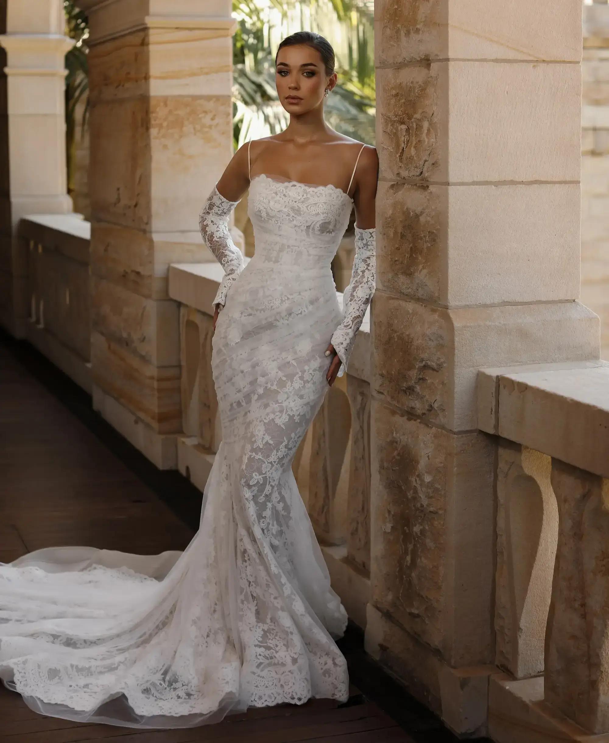 Model wearing a white gown by Hera Couture